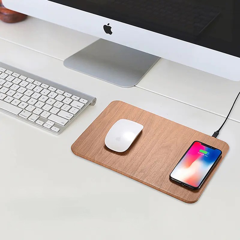 This innovative accessory combines the utility of a mouse pad with the modern convenience of a fast wireless charger.