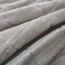 Coperta terapeutica pesante per dormire e rilassarsi, realizzata in peluche e microfibra, che riduce lo stress e dona una sensazione di abbraccio e un sonno più tranquillo.