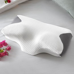 Un cuscino cervicale viscoelastico dai contorni ergonomici per un sostegno ottimale della testa, del collo e delle mani che aiuta a dormire nella postura più corretta.