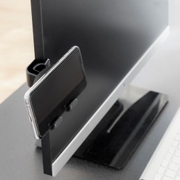 Um inovador suporte para o telemóvel com mola e peça de silicone adicional, que se adapta facilmente a várias superfícies e larguras.